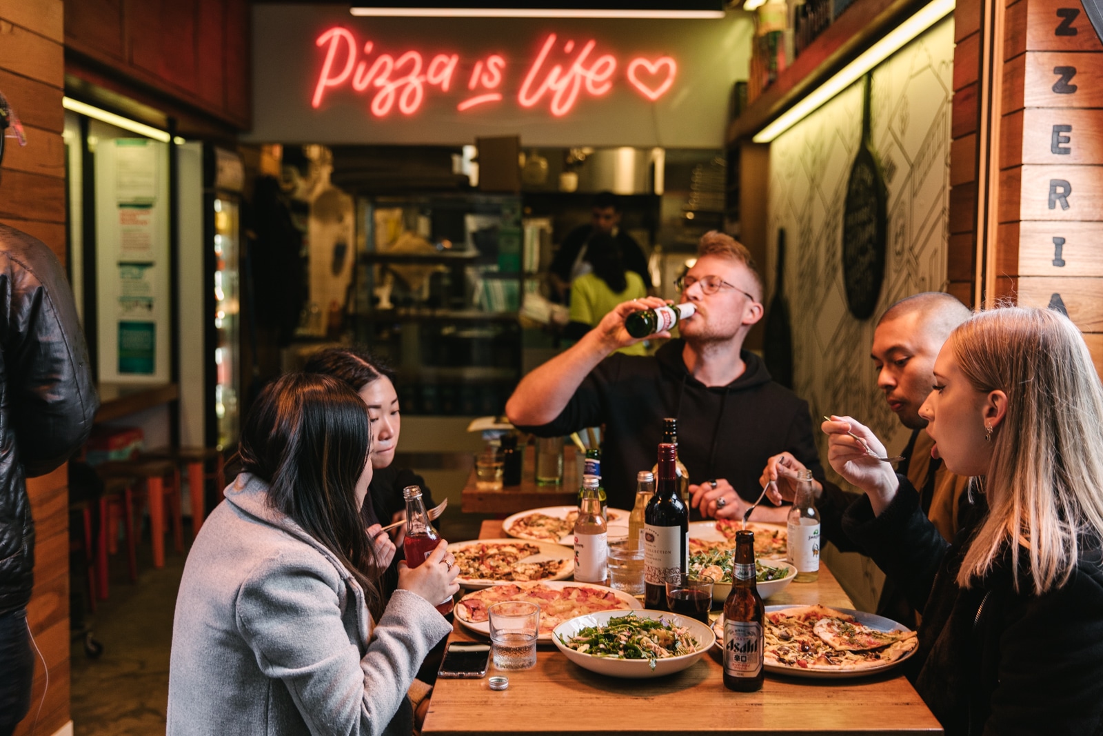 customers eating 11inch pizza