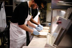 11 Inch Pizza team making pizza