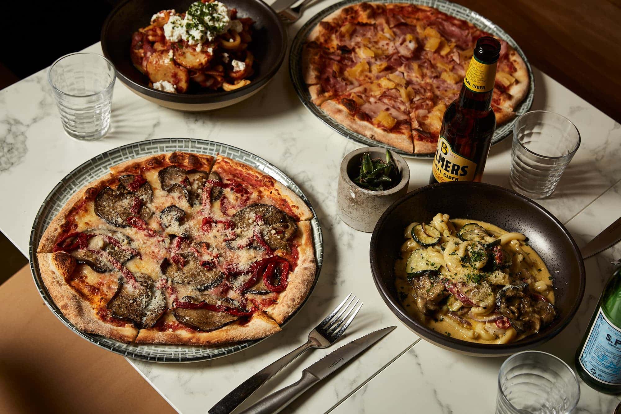 Pizza and Pasta on Table