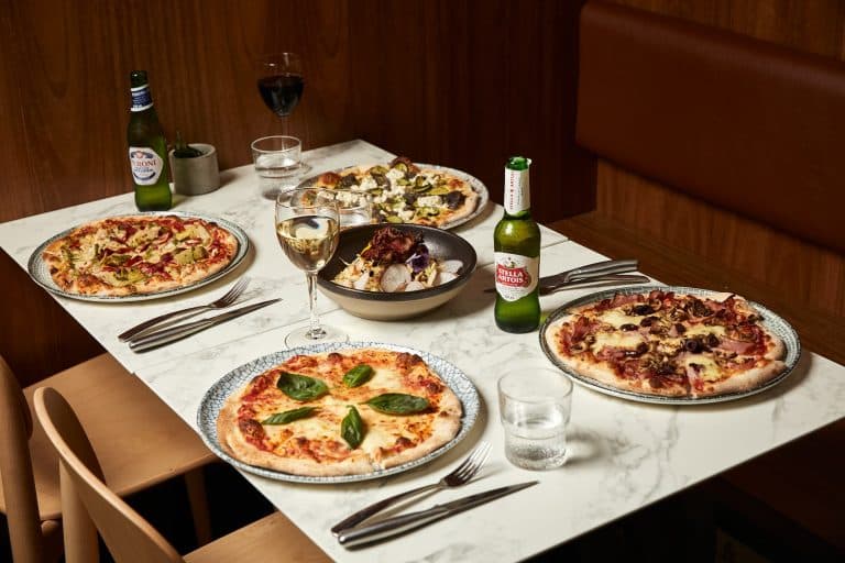 Delicious gourmet pizzas, fresh salad and drinks at 11 Inch Pizza—dine in or order online for a tasty treat.