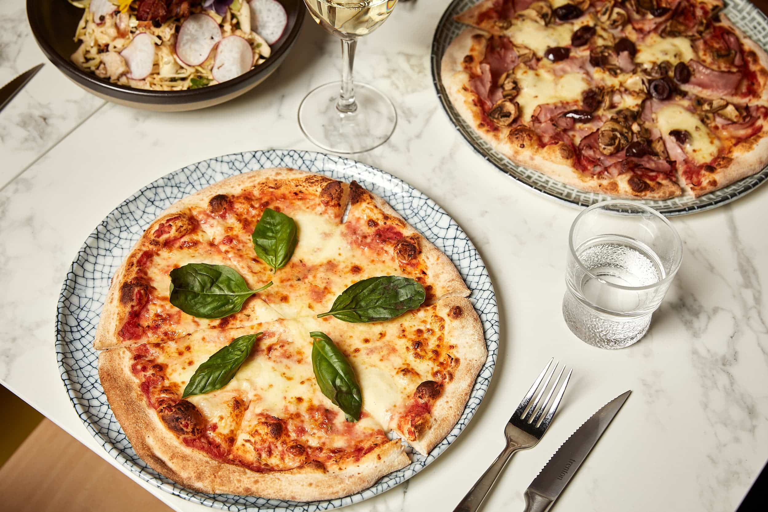 Classic Margherita pizza with basil leaves at 11 Inch Pizza Melbourne.
