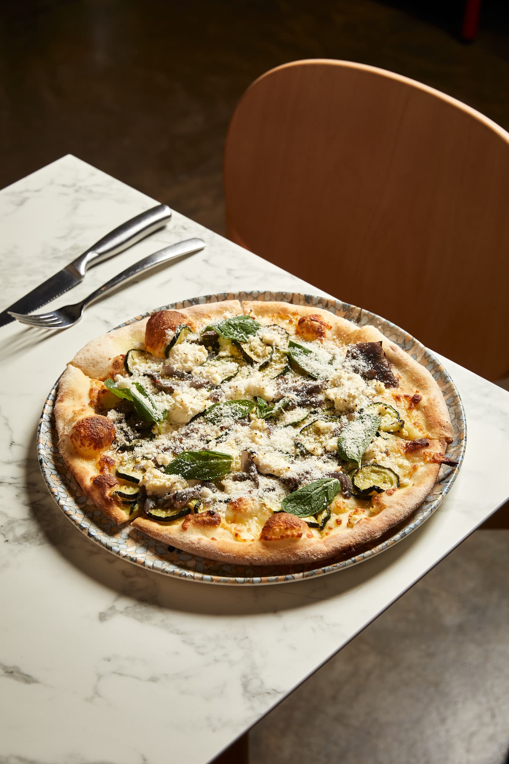 Ricotta and zucchini pizza served at 11 Inch Pizza Melbourne.